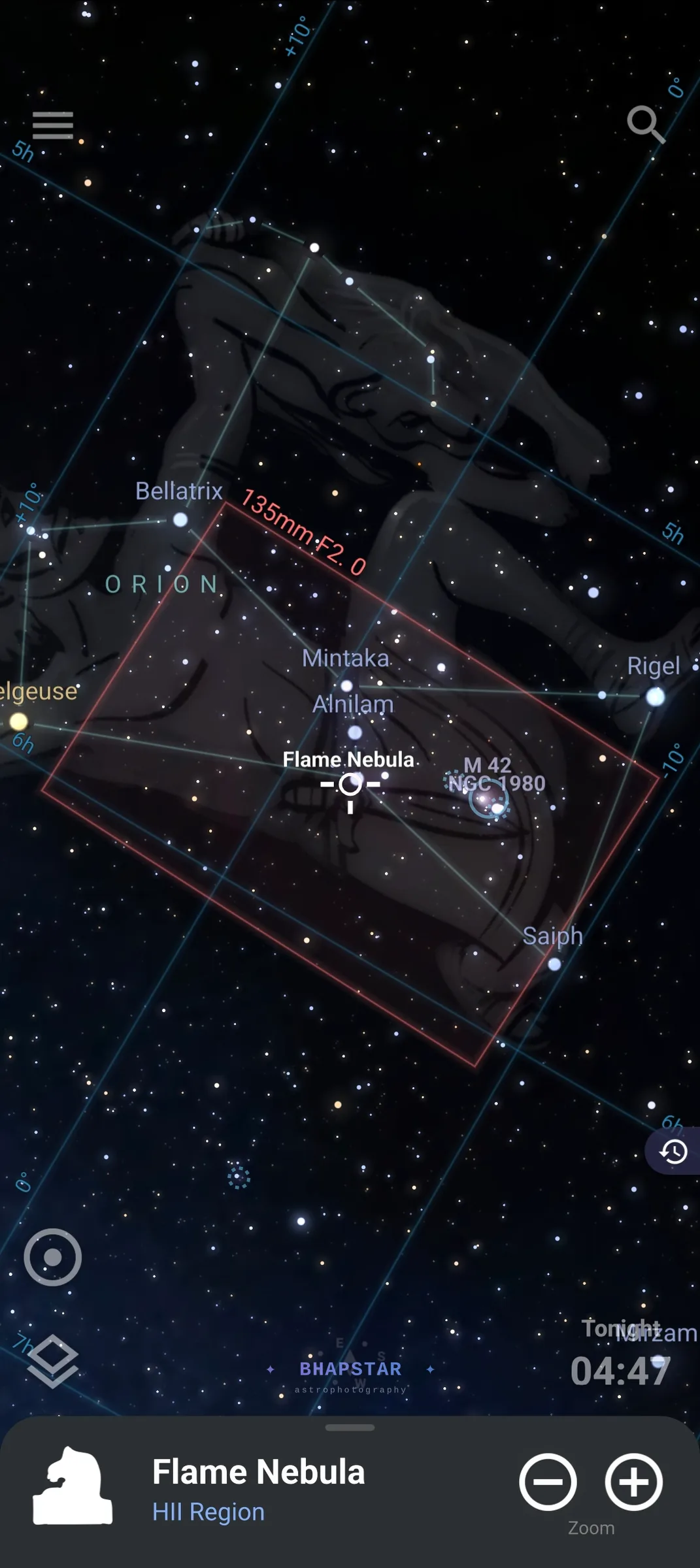 The Stellarium app with a red camera frame at 135mm f/2 covering almost the whole of Orion, from Bellatrix across the Belt down to Saiph, with the Flame Nebula reduced to a marker near the centre