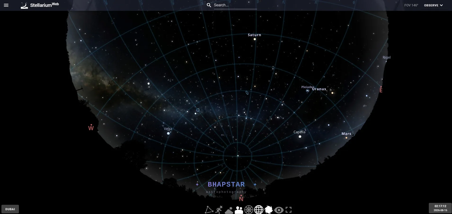 Stellarium Web open in a browser showing the whole sky above Dubai at about two in the morning, drawn as a circle with the horizon around the edge, Saturn and Uranus labelled and a grid of blue lines across it