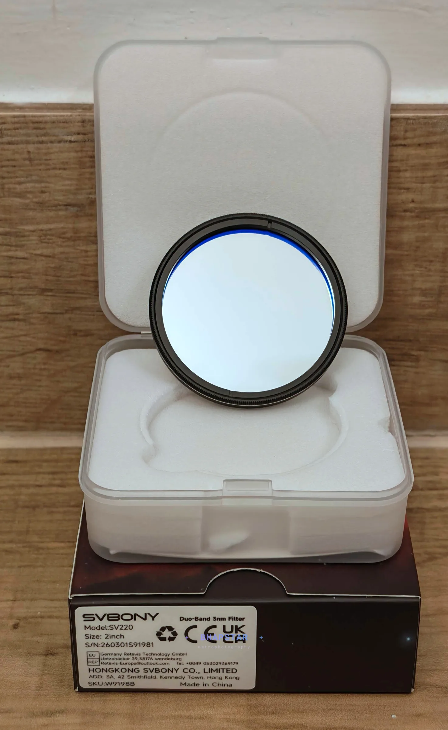 Svbony SV220 3nm filter face on in its case, showing the coating and the 2 inch cell