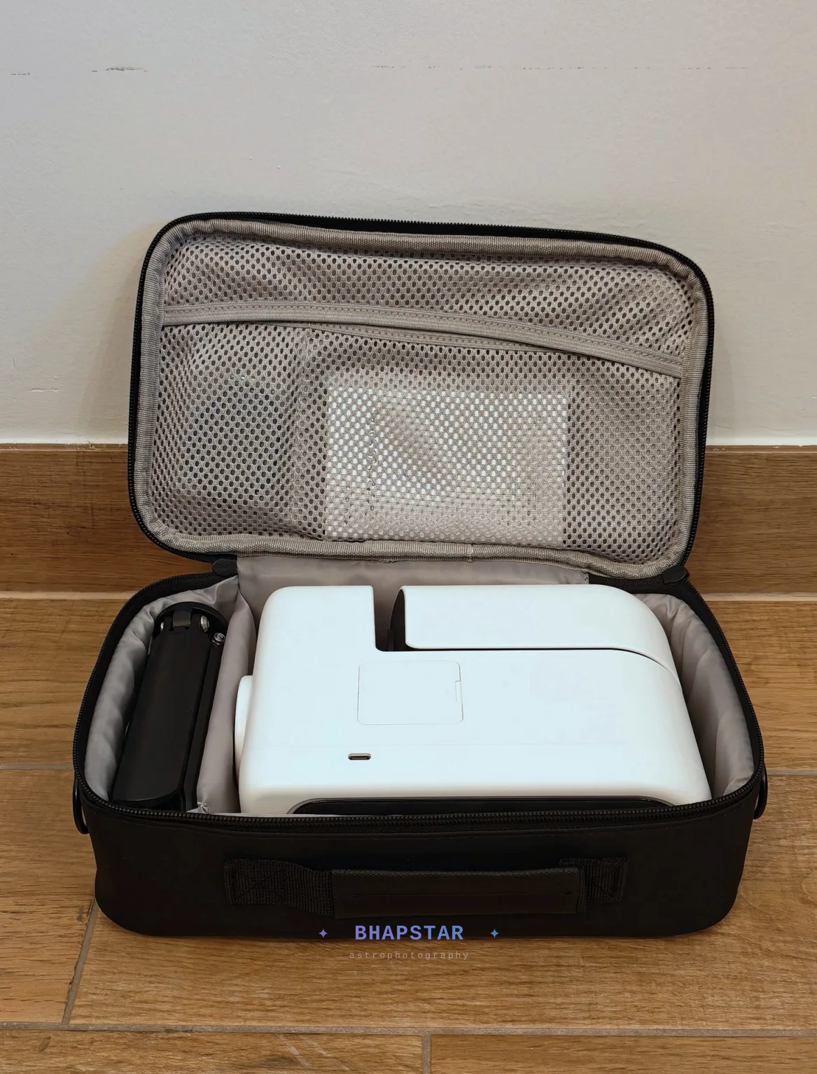 The Seestar S30 Pro packed flat in its carry case with the bundled feet alongside