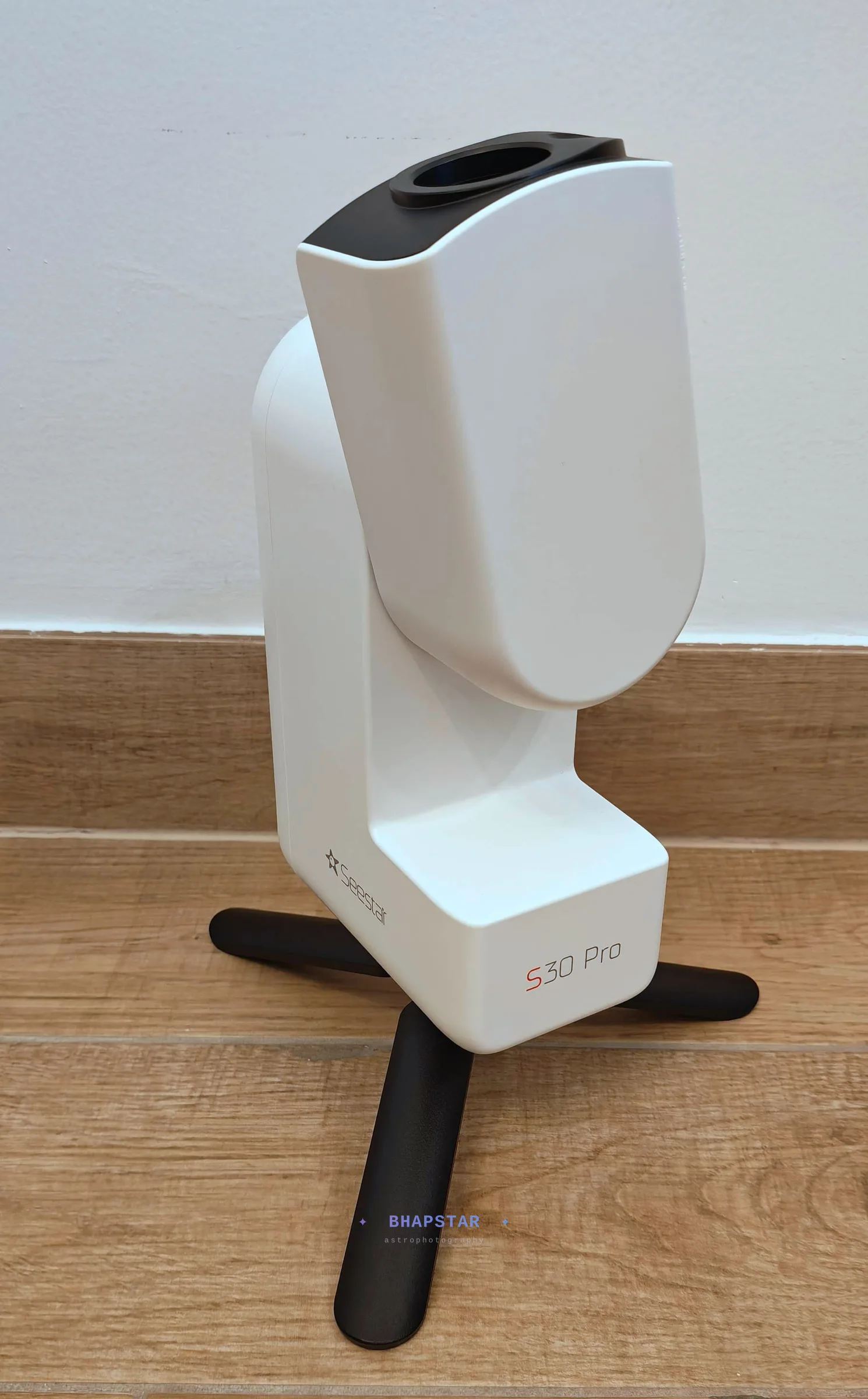 The Seestar S30 Pro on its bundled feet with the optical tube tilted up