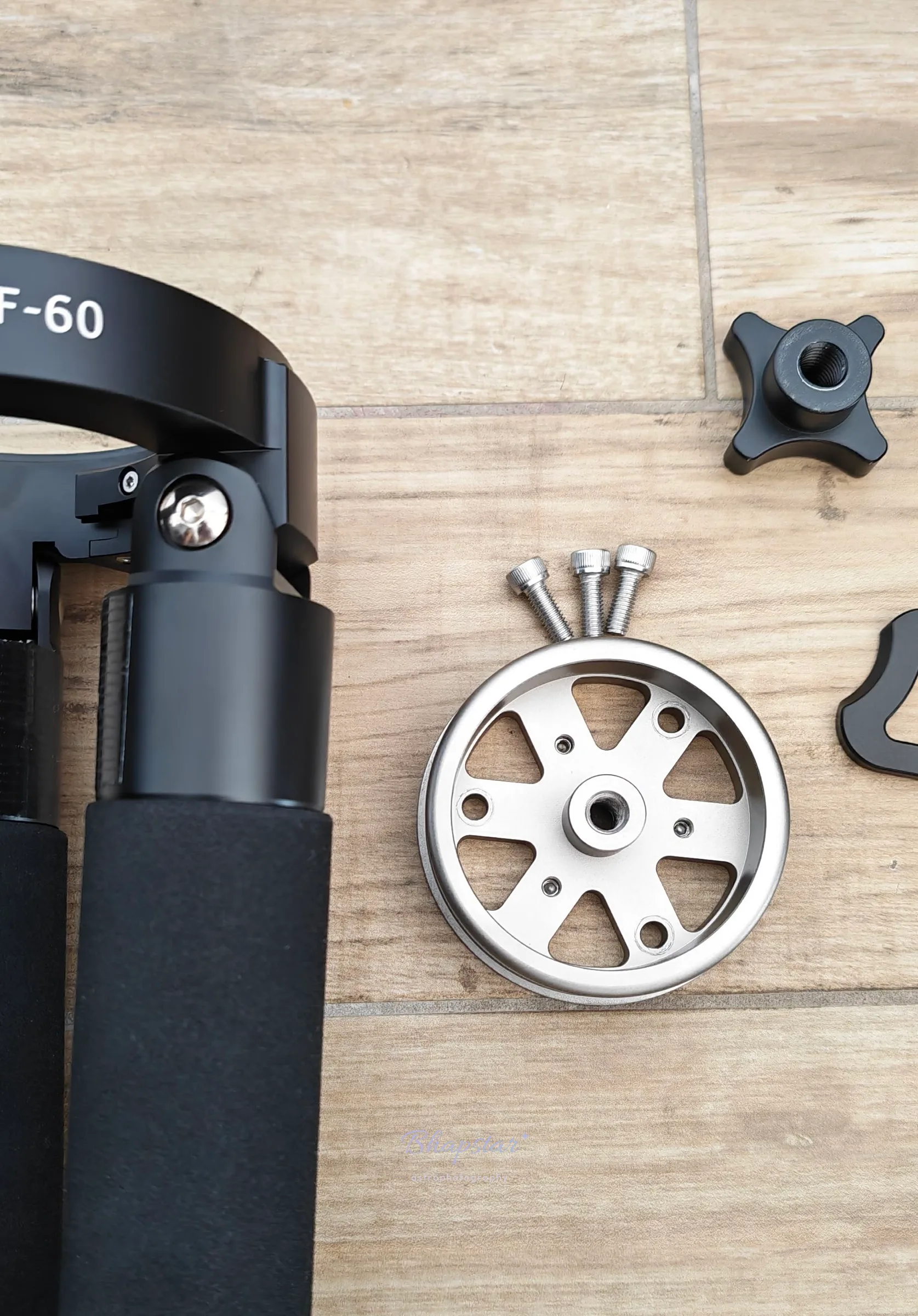 Close view of the CF-60 top ring and leg hinge, with the silver centre disc, grass spikes and a locking knob alongside