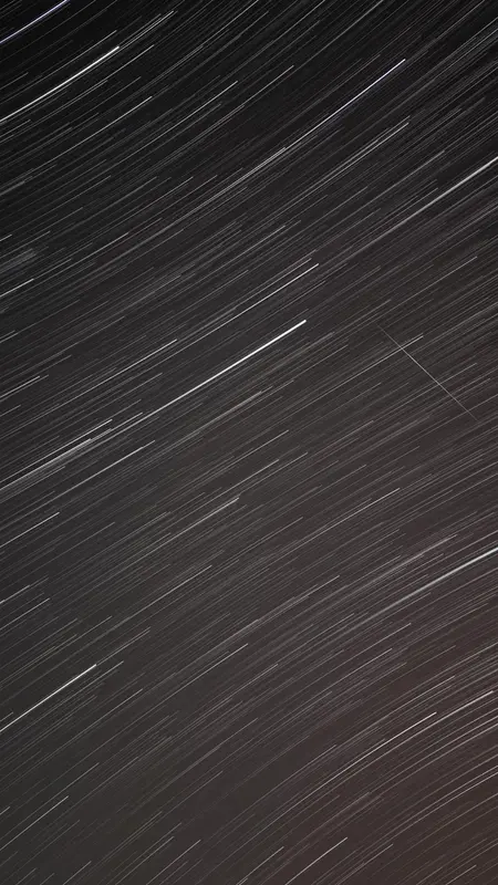 Long sweeping star trails well away from the celestial pole, arcing across the frame